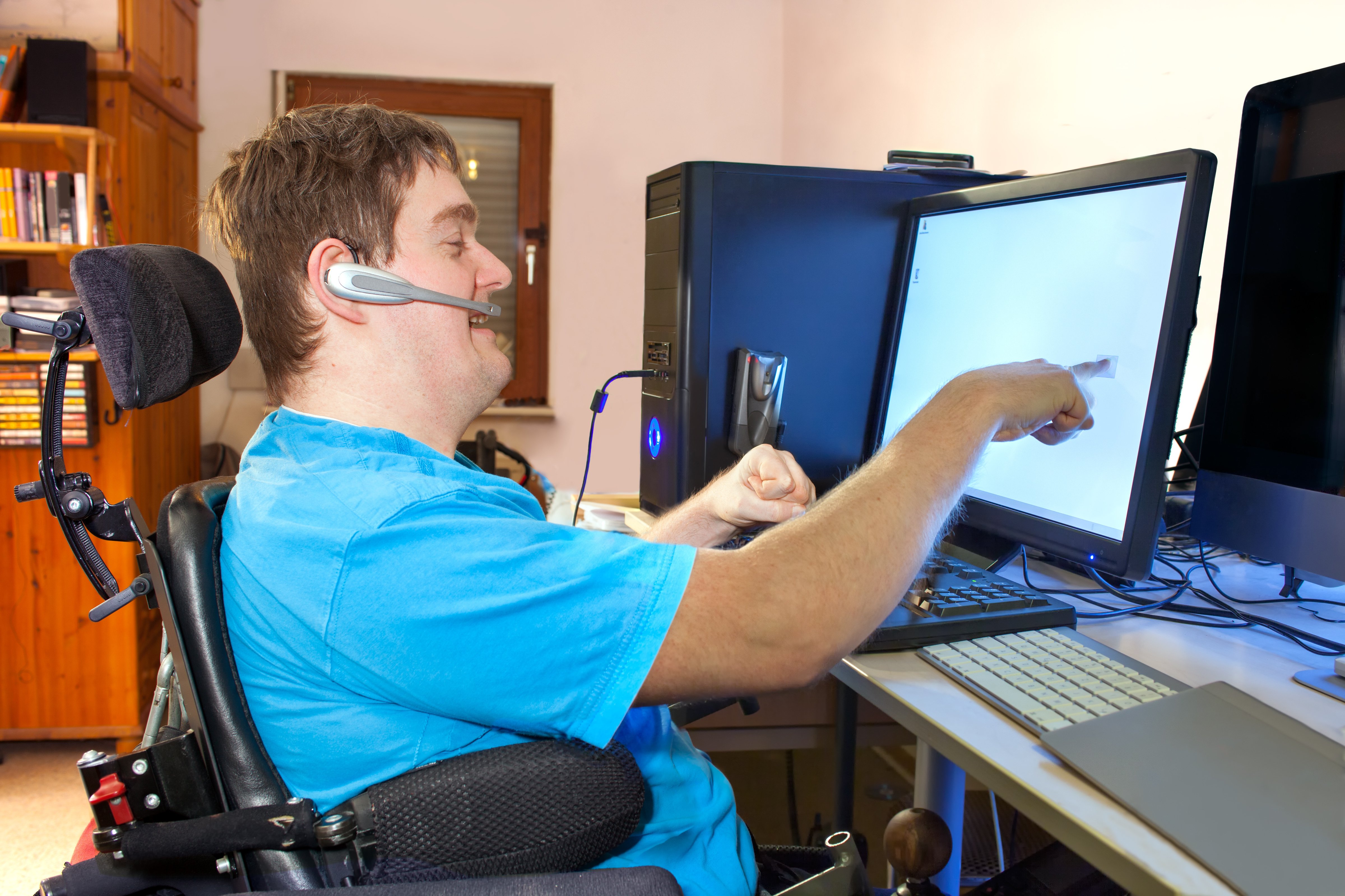 man with disability on the computer